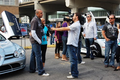 A reporter from CTV interviewed Solutions With Impact president Joel Hock at the 'Start Your Engines' brunch.