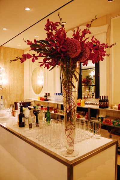 Tall vases filled with purple orchids from San Remo Florist topped bars at the Four Seasons Hotel, the site of the gala dinner.
