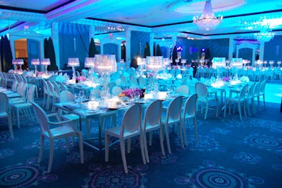 Rectangular tables surrounded by white Louis and Victoria Ghost chairs filled the Regency Ballroom at the Four Seasons Hotel.