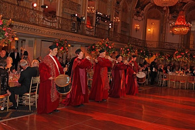 During a grand march presentation, trumpeters and drummers played as the opera stars entered the Hilton ballroom.