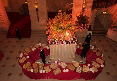 In the opera house's foyer, Heffernan Morgan's towering flower arrangements included coral roses, magnolia leaves, and vine maple.