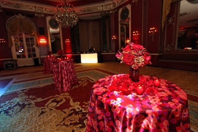 The dance party took place in the Red Laquer room, where rose petals topped highboys topped with silky linens.