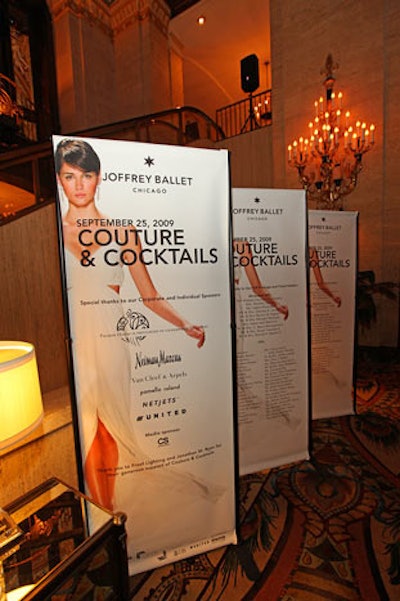 Signage in the lobby called out sponsors such as Neiman Marcus, NetJets, and United Airlines.