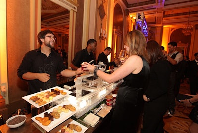In the ballroom, a Cold Stone Creamery station doled out ice cream sundaes in waffle cones.