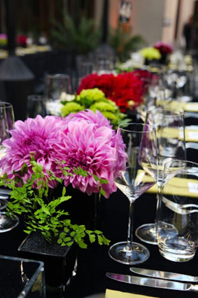 Black velvet cloths topped long tables.