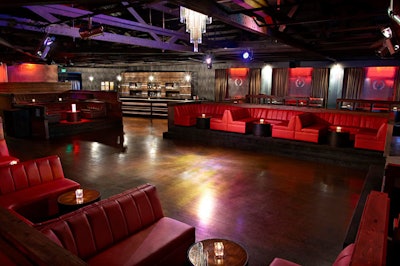 Red booths provide seating at Empire.