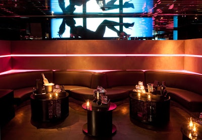 The decor of Mi-6 includes curvilinear seating arrangements and round tables for cocktails and bottle service.