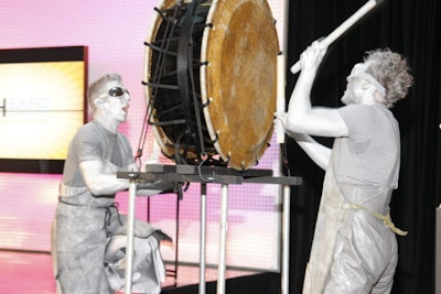 Silverguy Entertainment's silver drummers pounded on a large drum to signal the start of the morning general session.