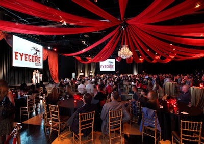 Guests watched the award show that took place on a mostly red stage set.