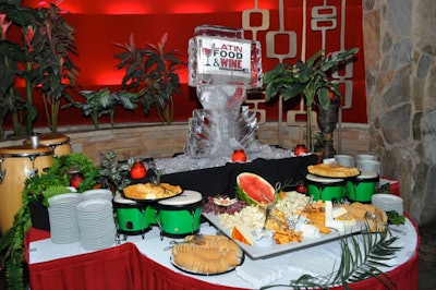 An ice sculpture with the event's logo sat atop a Latin cheeses display at the entrance to the club.