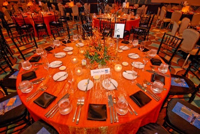 V.I.P. tables flipped the colors of the general admission tables, with orange cloths and black napkins.