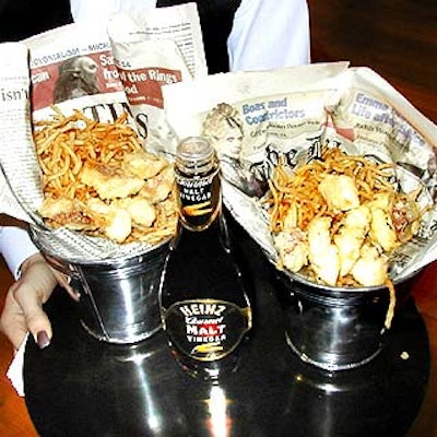 Traditional British fish and chips were doled out in buckets lined with the London Times. (Photo courtesy of Tentation)