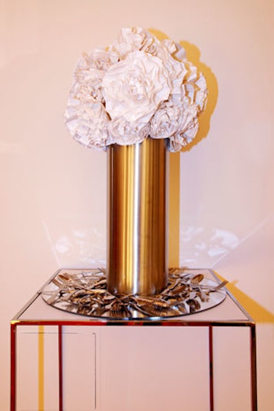 Rather than fresh cut flowers, designer Lynn Willis and his team cut and scrunched thousands of paper plates into flower-shaped arrangements.