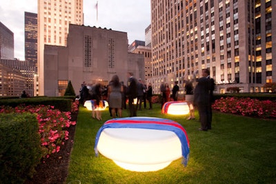 In preparation for chilly weather, the planning crew bought red, blue, and yellow pashminas off the street and placed the shawls atop the furniture on the terrace.