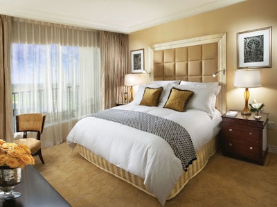 The 448-square-foot deluxe guest rooms feature Egyptian cotton sheets, a small sitting area, and a 42-inch high-definition LCD television.