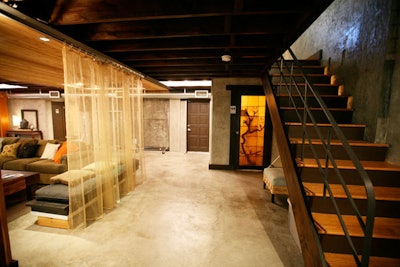 There is a lounge area in Studio A and a staircase leading to the mezzanine.