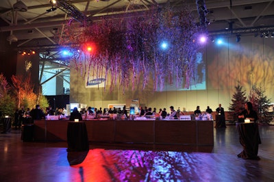 A canopy of trees hung above the bar for the cocktail reception, which had an enchanted forest theme.