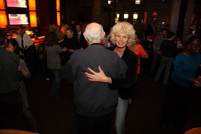 On the dance floor, instructors from Arthur Murray Dance Studio partnered with guests and led them through steps.