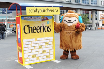 Quatchi, one of three Vancouver 2010 mascots, posed with the Cheerios Cheer wall.