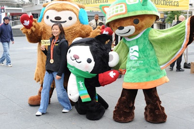 Vancouver 2010 mascots Quatchi, Miga, and Sumi posed for photos with attendees at Yonge-Dundas Square.