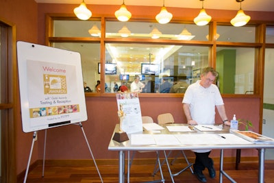At the N.A.S.F.T. event, guests received name tags and gift bags at a reception table.