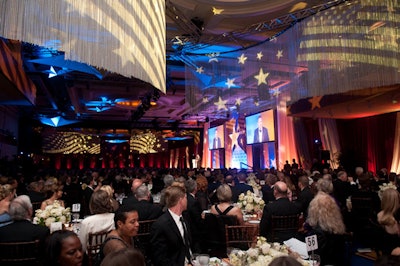 Atmosphere projected stars and flags onto fringe curtains that hung from the ceiling in the main dining room.