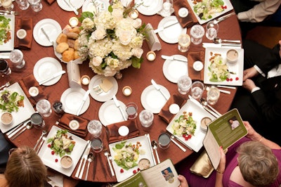 Perfect Settings provided the tables' brown, copper, and cream silk linens, while Spot Floral created the rose and hydrangea centerpieces.