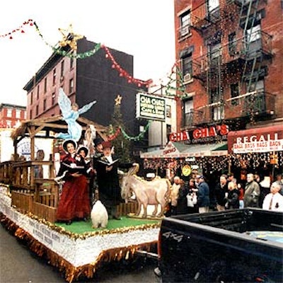 Mark Sonder Music's Holly Tones, dressed in traditional Dickensian costumes, performed Christmas carols at the Christmas in Little Italy festival on Mulberry Street. (Photo by Battman Studios)