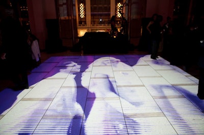 The dance floor played images of 1950s movies during dinner, and later busy street scenes moved on the floor in time with the music for dancing.