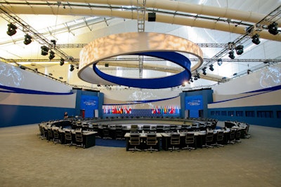 Custom built by Hargrove's in-house craftsmen, the table in the plenary room seated 55 global leaders and included a 50-foot decorative installation above the table.