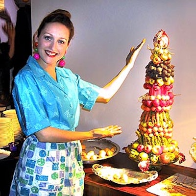 A server dressed as a cheery 50's housewife manned one of the food stations at Gourmet 's 60th anniversary party, which paired recipes from the last six decades with appropriate decor.