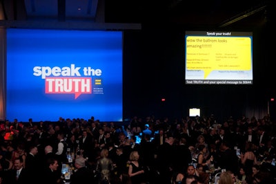 Before the program began and during the dinner break, large screens near the stage displayed text messages from audience members, a play on the evening's 'Speak the Truth' theme.