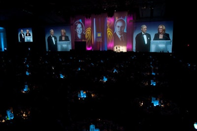 Giant screens on the stage displayed portraits of each presenter as they spoke while a video feed ensured the more than 3,000 guests could see the action on stage.