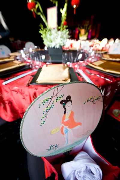 Decorative fans in the gift bags at each place setting added to the theme.