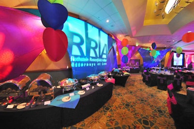 Floor-to-ceiling blue and purple spandex camouflaged the ballroom walls.
