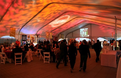 Similar to last year's setup, the Burger Bash built a large tent in the front to house the stage, some seating, and sponsors like The New York Times. Bentley Meeker provided the lighting, which included patterned projections and sponsor gobos.