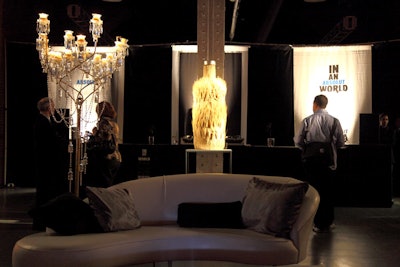 Also at Sweet, Absolut hosted a lounge decorated with a branded candelabrum, white lounge furniture, and an oversized bottle-shaped prop made from stalks of wheat.