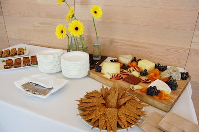 A food station had a selection of Canadian cheeses, fruits, and wild rice crackers.