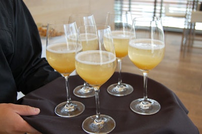 Servers offered glasses of JK Aqua Fresca, made with seasonal fruit puree and JK sparkling water, to guests as they arrived at the event.