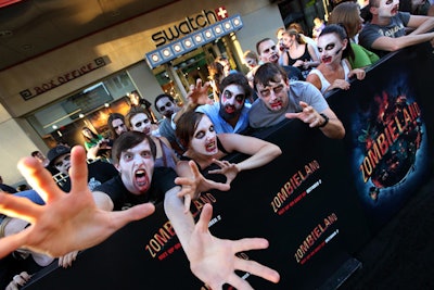 Costumed characters from Knott's Scary Farm, along with fans painted by makeup artists to look like zombies—for more than 150 monsters in all—created a creepy look on the red carpet for Zombieland. Sony's Bossert also oversaw the event.