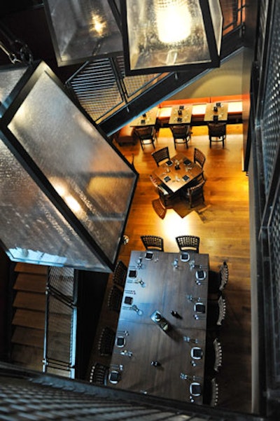 A wrought iron staircase separates the first floor bar and lounge area from the upstairs dining rooms.
