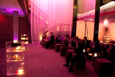 Gauzy scrims hanging from the atrium ceiling created a shadowy effect at the entrance to the Studio Party.