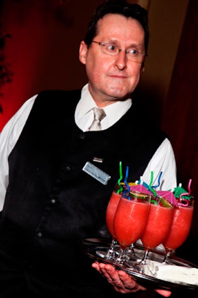 Servers passed the evening's signature cocktail: an umbrella-adorned strawberry daiquiri.