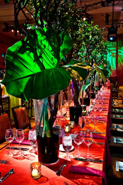 Tall leaves and vine centerpieces from Winston Flowers towered over the dining room's communal tables.