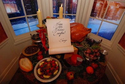 The table at the end of the car was set for a Christmas meal, complete with a note from Ebenezer Scrooge and a snowy London background on the windows.