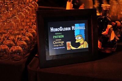 Mini screens atop bars advertised Halloween-themed signature cocktails.