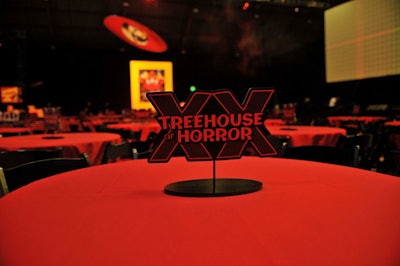 Stands stamped 'Treehouse of Horror ' topped tables.