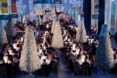Heffernan Morgan's decor incorporated chandeliers, cone-shaped topiaries, and illuminated centerpieces.