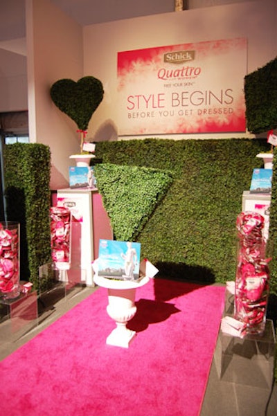 Pink and green decor fill the Schick Quattro for Women booth, where guests can pick up complimentary razors.
