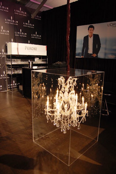 Rob Dittmer created chandelier cruiser tables for the all-black Lincoln Luxury Lounge.